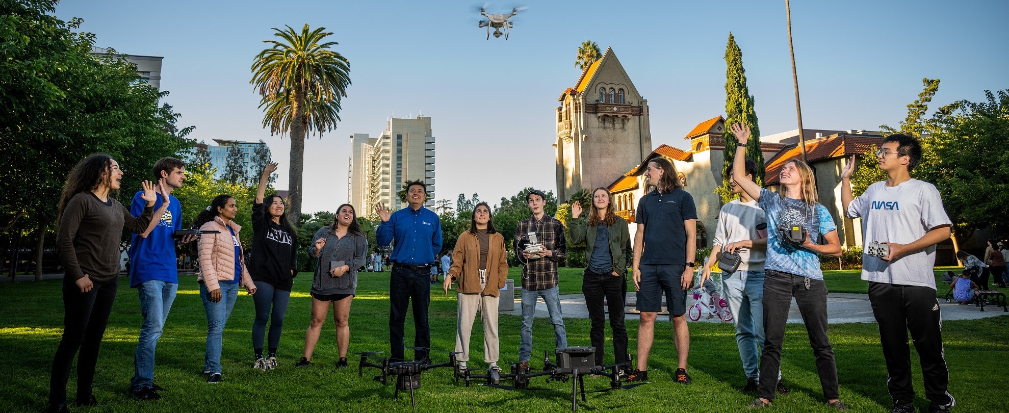 GeoFly Lab members with drones on campus